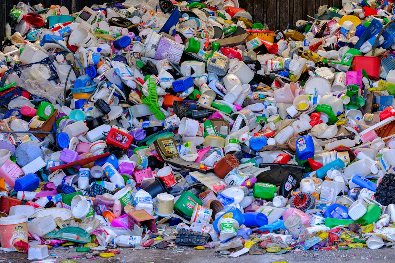 journey Massive colorful collection of used plastic bottles and containers in a recycling center.